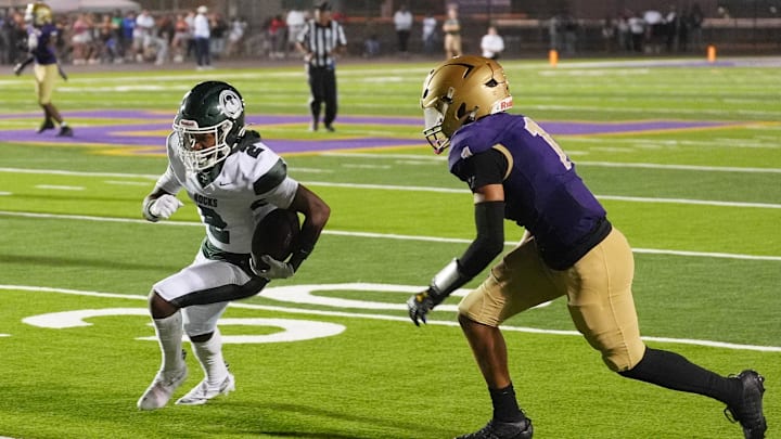 Trinity makes a move against Male at Veterans Memorial Stadium.