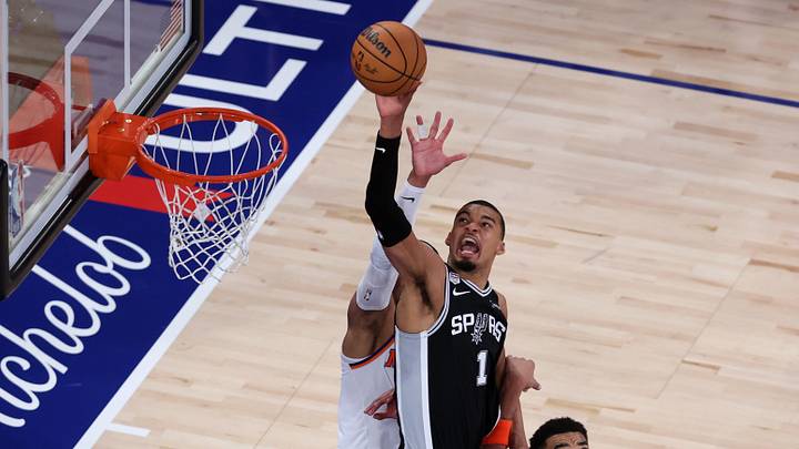 Spurs forward Victor Wembanyama shoots the ball against Knicks center Karl-Anthony Towns in Game 3 of the NBA Finals on Monday. Spurs forward Victor Wembanyama shoots the ball against Knicks center Karl-Anthony Towns in Game 3 of the NBA Finals on Monday.