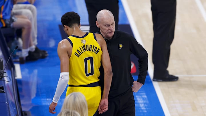 Jun 16, 2025; Oklahoma City, Oklahoma, USA; Indiana Pacers guard Tyrese Haliburton (0) comes off the floor past head coach Rick Carlisle in the first quarter against the Oklahoma City Thunder during game five of the 2025 NBA Finals at Paycom Center. Mandatory Credit: Alonzo Adams-Imagn Images Jun 16, 2025; Oklahoma City, Oklahoma, USA; Indiana Pacers guard Tyrese Haliburton (0) comes off the floor past head coach Rick Carlisle in the first quarter against the Oklahoma City Thunder during game five of the 2025 NBA Finals at Paycom Center. Mandatory Credit: Alonzo Adams-Imagn Images