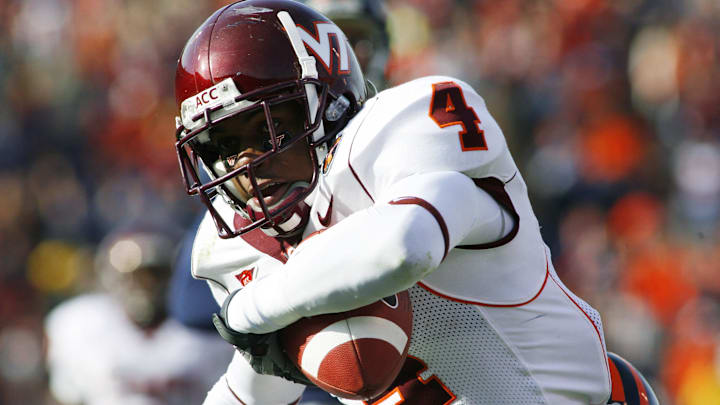 Nov.24, 2007; Charlottesville, VA, USA; Virginia Tech Hokies wide receiver Eddie Royal (4) scores a touchdown as Virginia Cavaliers safety Byron Glaspy (22) attempts a tackle in the second quarter at Scott Stadium in Charlottesville, VA. Mandatory Credit: Geoff Burke-Imagn Images Nov.24, 2007; Charlottesville, VA, USA; Virginia Tech Hokies wide receiver Eddie Royal (4) scores a touchdown as Virginia Cavaliers safety Byron Glaspy (22) attempts a tackle in the second quarter at Scott Stadium in Charlottesville, VA. Mandatory Credit: Geoff Burke-Imagn Images