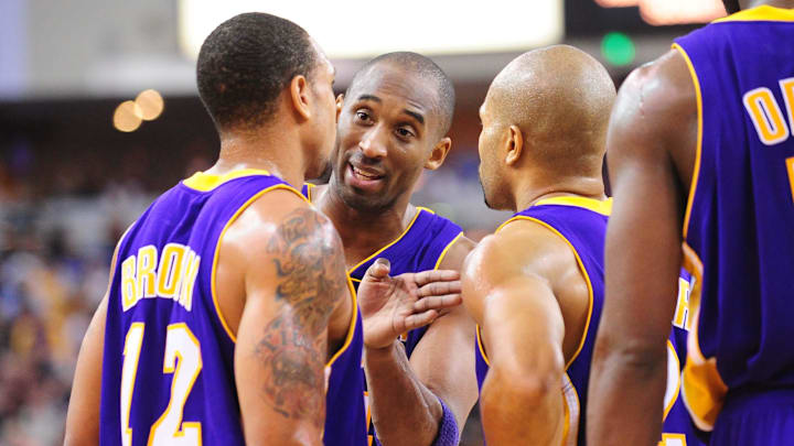 December 26, 2009; Sacramento, CA, USA; Los Angeles Lakers guard Kobe Bryant (center) instructs guard Shannon Brown (12) while guard Derek Fisher (right) looks on during the fourth quarter against the Sacramento Kings at Arco Arena. The Lakers defeated the Kings 112-103 in double overtime. Mandatory Credit: Kyle Terada-Imagn Images