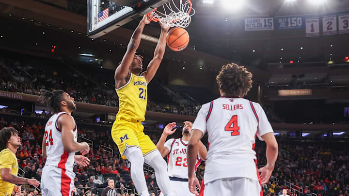 Oct 25, 2025; New York, NY, USA; Michigan Wolverines forward Morez Johnson Jr. (21) dunks in the first half against the St. John's Red Storm at Madison Square Garden. Mandatory Credit: Wendell Cruz-Imagn Images Oct 25, 2025; New York, NY, USA; Michigan Wolverines forward Morez Johnson Jr. (21) dunks in the first half against the St. John's Red Storm at Madison Square Garden. Mandatory Credit: Wendell Cruz-Imagn Images