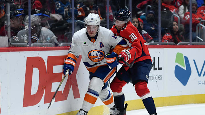 Feb 2, 2026; Washington, District of Columbia, USA; New York Islanders center Bo Horvat (14) controls the puck defended by Washington Capitals defenseman Rasmus Sandin (38) during the third period at Capital One Arena. Mandatory Credit: Hannah Foslien-Imagn Images