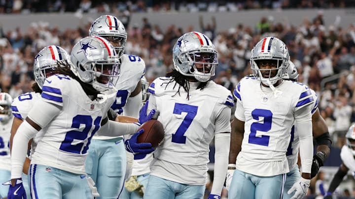 Nov 10, 2024; Arlington, Texas, USA; Dallas Cowboys cornerback Trevon Diggs (7) and his teammates react after an interception in the second quarter against the Philadelphia Eagles at AT&T Stadium. Mandatory Credit: Tim Heitman-Imagn Images