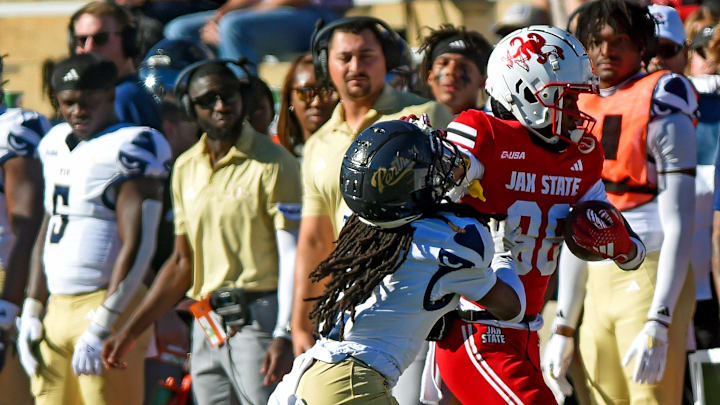 Jacksonville State's Jordan McCants tries to evade the tackle of FIU's Brian Blades II during college football action at AmFirst Stadium in Jacksonville, Alabama November 16, 2024. (Dave Hyatt / Hyatt Media LLC)