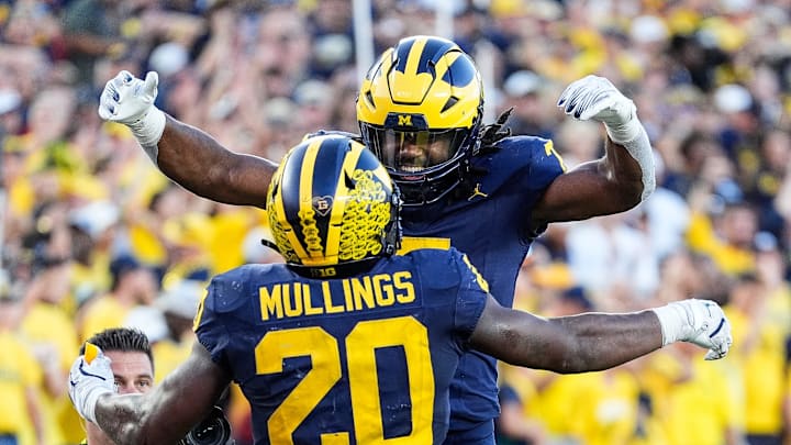 running back Kalel Mullings (20) celebrates a touchdown against USC with running back Donovan Edwards (7) during the second half at Michigan Stadium in Ann Arbor on Saturday, Sept. 21, 2024.