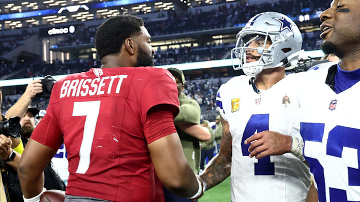 Nov 3, 2025; Arlington, Texas, USA; Arizona Cardinals quarterback Jacoby Brissett (7) and Dallas Cowboys quarterback Dak Prescott (4) shake hands after the game at AT&T Stadium. Mandatory Credit: Kevin Jairaj-Imagn Images