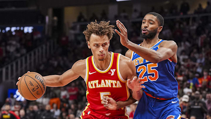 Nov 6, 2024; Atlanta, Georgia, USA; Atlanta Hawks guard Dyson Daniels (5) dribbles defended by New York Knicks forward Mikal Bridges (25) during the second half at State Farm Arena. Mandatory Credit: Dale Zanine-Imagn Images
