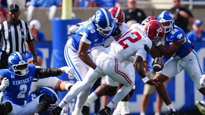 Kentucky Wildcats defensive lineman Mi'quise Humphrey-Grace (90) hits Alabama Crimson Tide quarterback Keelon Russell (12) to cause a Tide fumble and Cat recover in the first half Saturday, Sept. 12, 2026 in Lexington, Kentucky. Kentucky Wildcats defensive lineman Mi'quise Humphrey-Grace (90) hits Alabama Crimson Tide quarterback Keelon Russell (12) to cause a Tide fumble and Cat recover in the first half Saturday, Sept. 12, 2026 in Lexington, Kentucky.
