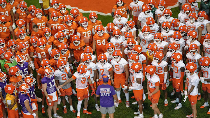 Clemson head coach Dabo Swinney talks with players before going outside for practice at the Allen N. Reeves Football Complex in Clemson, S.C. Friday, August 1, 2025.