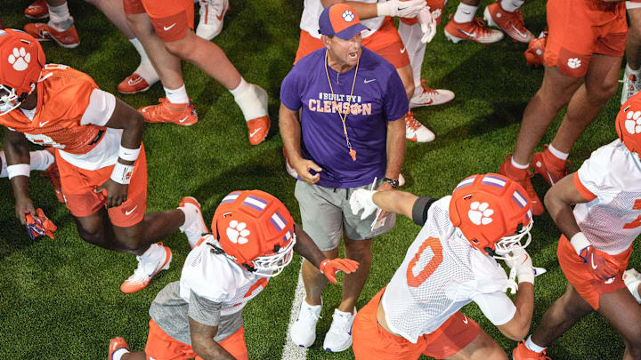 Clemson head coach Dabo Swinney breaks from talking with players as they run outside for practice at the Allen N. Reeves Football Complex in Clemson, S.C. Friday, August 1, 2025.
