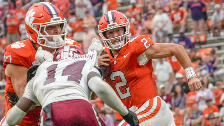 Clemson quarterback Cade Klubnik (2) runs near Troy Trojans safety David Daniel-Sisavanh (14) during the third quarter at Memorial Stadium in Clemson, S.C. Saturday, September 6, 2025.