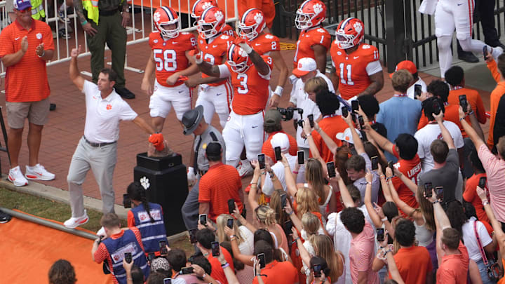 Clemson head coach Dabo Swinney rubs Howard’s Rock near the team before the game with Clemson and Troy at Memorial Stadium in Clemson, S.C. Saturday, September 6, 2025.