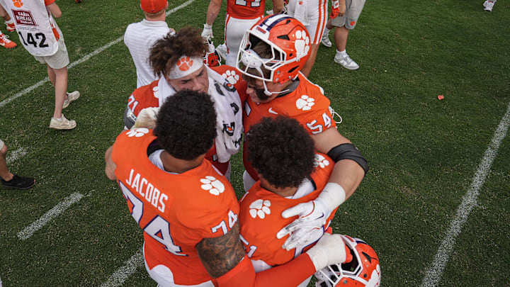 Sep 20, 2025; Clemson, South Carolina, USA; Clemson Tigers offensive lineman Brayden Jacobs (74), offensive lineman Tristan Leigh (71), offensive lineman Ian Reed (54) and offensive lineman Gavin Blanchard (51) console each other after losing to the Syracuse Orange at Memorial Stadium. Mandatory Credit: Ken Ruinard/GREENVILLE NEWS-USA TODAY Network via Imagn Images