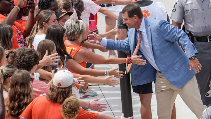 Clemson head coach Dabo Swinney exchanges greetings with fans during Clemson Tiger Walk, two hours before kickoff with Troy University, at Memorial Stadium in Clemson Saturday, August 31, 2025.