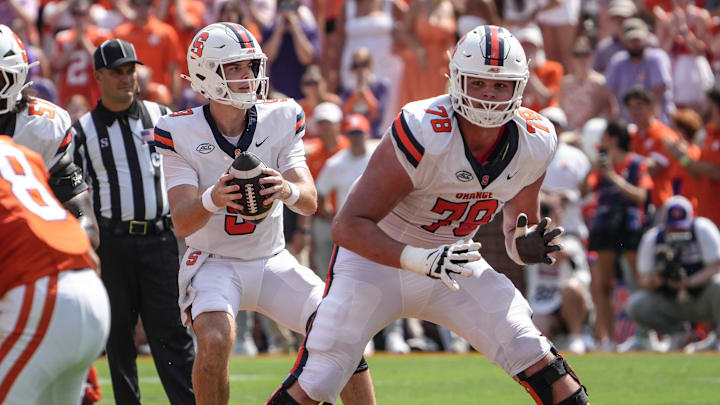 Sep 20, 2025; Clemson, South Carolina, USA; Syracuse Orange quarterback Steve Angeli (9) takes a snap near offensive lineman Joe Cruz (78) playing the Clemson Tigers during the first quarter at Memorial Stadium. Mandatory Credit: Ken Ruinard/GREENVILLE NEWS-USA TODAY Network via Imagn Images