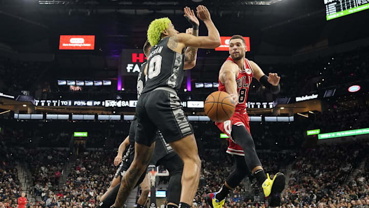 Chicago Bulls guard Zach LaVine (8) passes around San Antonio Spurs forward Jeremy Sochan (10) during the first half at Frost Bank Center. Mandatory Credit: Scott Wachter-Imagn Images