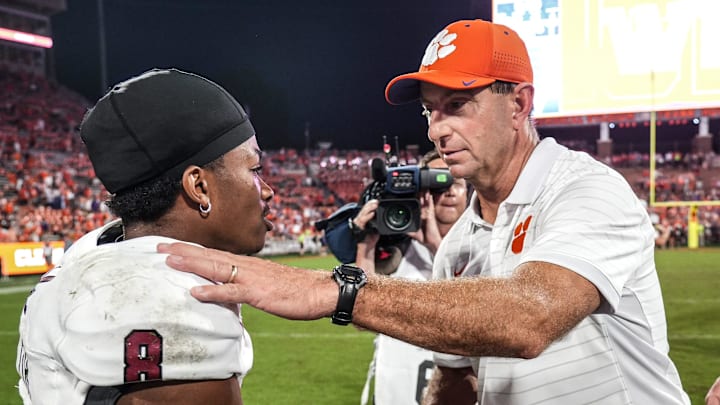 Clemson head coach Dabo Swinney shakes hands and wishes Troy Trojans receiver Tray Taylor (8) 