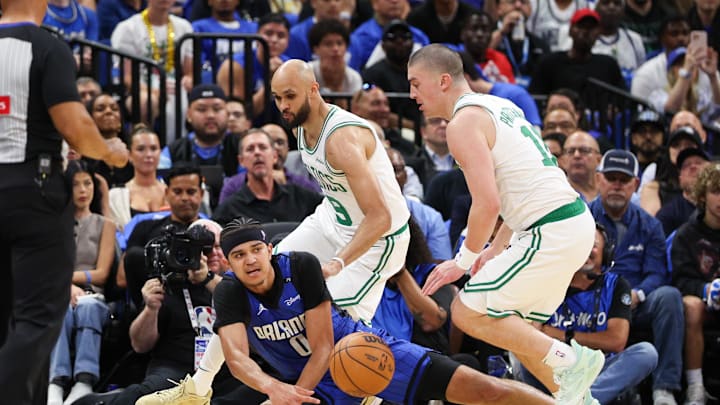 Apr 27, 2025; Orlando, Florida, USA; Orlando Magic guard Anthony Black (0) and Boston Celtics guard Payton Pritchard (11) scramble for a loos ball in the second quarter during game four of first round for the 2025 NBA Playoffs at Kia Center. Mandatory Credit: Nathan Ray Seebeck-Imagn Images Apr 27, 2025; Orlando, Florida, USA; Orlando Magic guard Anthony Black (0) and Boston Celtics guard Payton Pritchard (11) scramble for a loos ball in the second quarter during game four of first round for the 2025 NBA Playoffs at Kia Center. Mandatory Credit: Nathan Ray Seebeck-Imagn Images