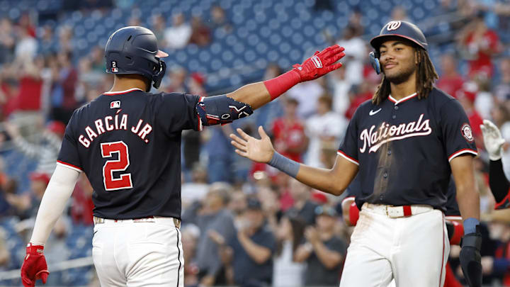 Aug 21, 2024; Washington, District of Columbia, USA; Washington Nationals second baseman Luis García Jr. (2) celebrates with Nationals outfielder James Wood (29) after hitting a three run home run against the Colorado Rockies during the third inning at Nationals Park.