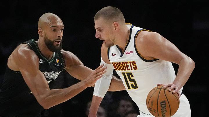 Apr 23, 2026; Minneapolis, Minnesota, USA; Denver Nuggets center Nikola Jokic (15) works around Minnesota Timberwolves center Rudy Gobert (27) in the first quarter at Target Center. Mandatory Credit: Bruce Kluckhohn-Imagn Images