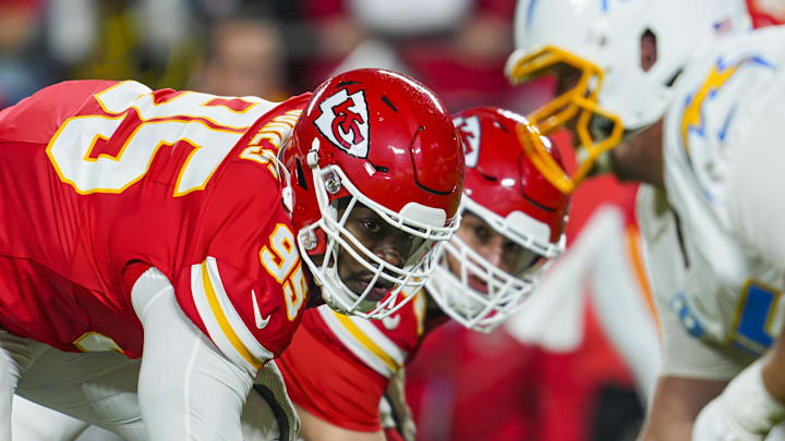 Dec 8, 2024; Kansas City, Missouri, USA; Kansas City Chiefs defensive tackle Chris Jones (95) and defensive end George Karlaftis (56) get ready before the snap during the first half against the Los Angeles Chargers at GEHA Field at Arrowhead Stadium. Mandatory Credit: Jay Biggerstaff-Imagn Images