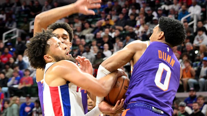 Oct 8, 2024; East Lansing, Michigan, USA; Detroit Pistons guard Cade Cunningham (2) loses the ball to Phoenix Suns forward Ryan Dunn (0) at Jack Breslin Student Events Center. Mandatory Credit: Dale Young-Imagn Images Oct 8, 2024; East Lansing, Michigan, USA; Detroit Pistons guard Cade Cunningham (2) loses the ball to Phoenix Suns forward Ryan Dunn (0) at Jack Breslin Student Events Center. Mandatory Credit: Dale Young-Imagn Images