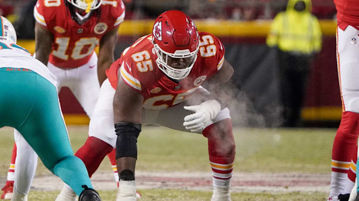 Kansas City Chiefs guard Trey Smith (65) on the line of scrimmage against the Miami Dolphins in a 2024 AFC wild card game at GEHA Field at Arrowhead Stadium.