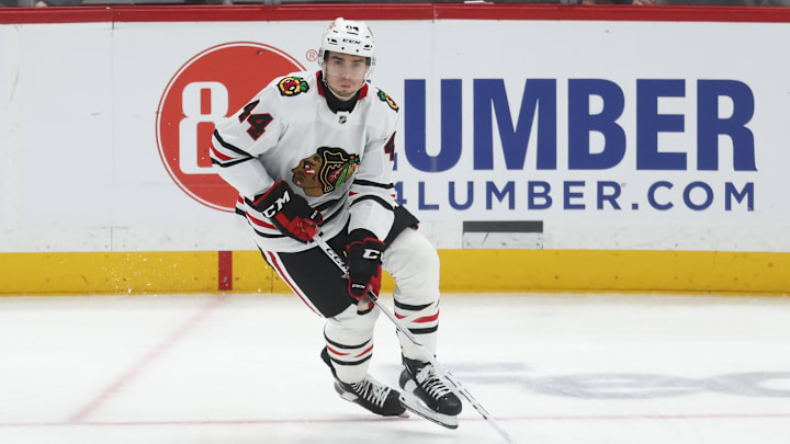 Apr 8, 2025; Pittsburgh, Pennsylvania, USA;  Chicago Blackhawks defenseman Wyatt Kaiser (44) skates with the puck against the Pittsburgh Penguins during the second period at PPG Paints Arena. Mandatory Credit: Charles LeClaire-Imagn Images