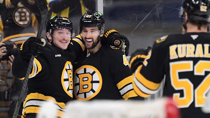 Apr 14, 2026; Boston, Massachusetts, USA; Boston Bruins left wing Tanner Jeannot (84) celebrates after a goal by center Mark Kastelic (47) during the first period against the New Jersey Devils at TD Garden. Mandatory Credit: Bob DeChiara-Imagn Images