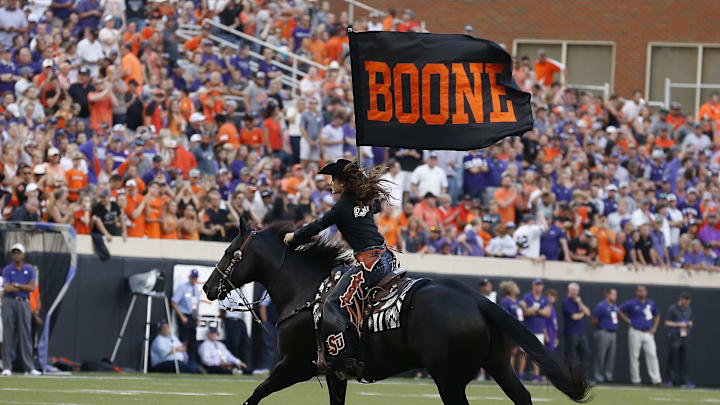 Sep 28, 2019; Stillwater, OK, USA; Spirit the mascot rides with a Boone flag in memory of T. Boone Pickens during a game against the Kansas State Wildcats at Boone Pickens Stadium. Mandatory Credit: Alonzo Adams-Imagn Images