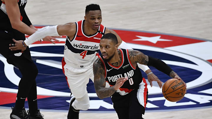 Feb 2, 2021; Washington, District of Columbia, USA; Portland Trail Blazers guard Damian Lillard (0) drives past Washington Wizards guard Russell Westbrook (4) during the fourth quarter at Capital One Arena. Mandatory Credit: Brad Mills-Imagn Images Feb 2, 2021; Washington, District of Columbia, USA; Portland Trail Blazers guard Damian Lillard (0) drives past Washington Wizards guard Russell Westbrook (4) during the fourth quarter at Capital One Arena. Mandatory Credit: Brad Mills-Imagn Images