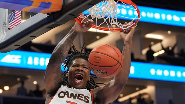 Mar 12, 2026; Charlotte, NC, USA; Miami (FL) Hurricanes forward Shelton Henderson (7) scores the last two points of the game at Spectrum Center. Mandatory Credit: Bob Donnan-Imagn Images