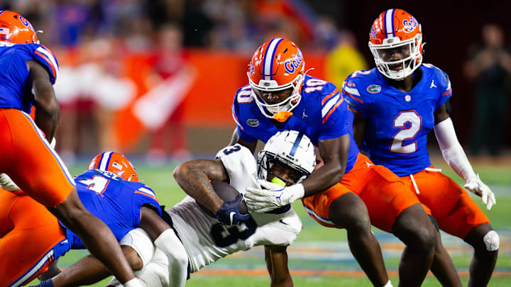Florida Gators linebacker Grayson Howard (10) tackles Samford Bulldogs wide receiver E. Jai Mason (3) during the second half at Ben Hill Griffin Stadium in Gainesville, FL on Saturday, September 7, 2024 against the Samford Bulldogs. The Florida Gators won 45-7 over the Bulldogs. [Doug Engle/Gainesville Sun]