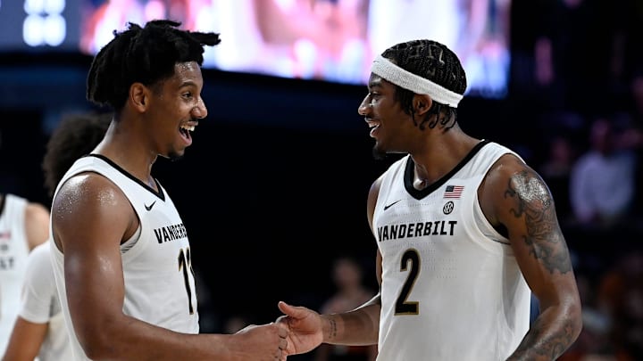 Vanderbilt’s A.J. Hoggard (11) and M.J. Collins Jr. (2) celebrate after defeating Texas in a NCAA college basketball game Saturday, Feb. 8, 2025, in Nashville, Tenn. Vanderbilt won 86-78.