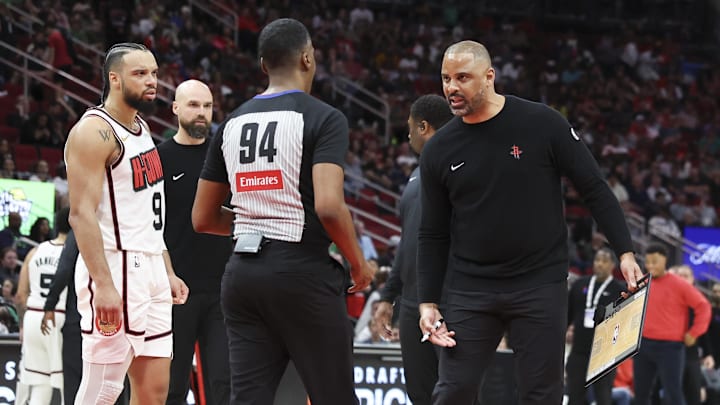 Mar 17, 2025; Houston, Texas, USA; Houston Rockets head coach Ime Udoka taks with a referee during a timeout during the fourth quarter against the Philadelphia 76ers at Toyota Center. Mandatory Credit: Troy Taormina-Imagn Images Mar 17, 2025; Houston, Texas, USA; Houston Rockets head coach Ime Udoka taks with a referee during a timeout during the fourth quarter against the Philadelphia 76ers at Toyota Center. Mandatory Credit: Troy Taormina-Imagn Images