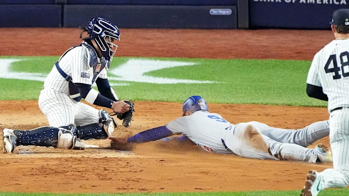 Oct 28, 2024; New York, New York, USA; New York Yankees catcher Jose Trevino (39) tags out Los Angeles Dodgers second baseman Gavin Lux (9) at home plate during the fourth inning in game three of the 2024 MLB World Series at Yankee Stadium. Mandatory Credit: Robert Deutsch-Imagn Images