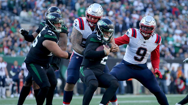 Oct 30, 2022; East Rutherford, New Jersey, USA; New York Jets quarterback Zach Wilson (2) is sacked by New England Patriots defensive end Lawrence Guy (93) and linebacker Matthew Judon (9) during the fourth quarter at MetLife Stadium. Mandatory Credit: Brad Penner-USA TODAY Sports