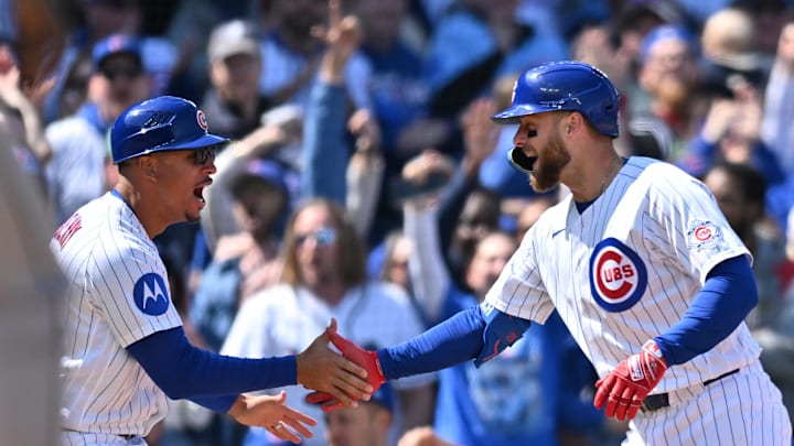 May 3, 2026; Chicago, Illinois, USA; Chicago Cubs first baseman Michael Busch (29) celebrates with third base coach Quintin Berry (0) after hitting a three-run triple against the Arizona Diamondbacks during the fifth inning at Wrigley Field. Mandatory Credit: Patrick Gorski-Imagn Images