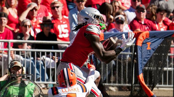 Ohio State Buckeyes wide receiver Jeremiah Smith (4) catches a pass over Illinois Fighting Illini defensive back Juice Clarke (6) during the NCAA football game at Ohio Stadium in Columbus on Sept. 26, 2026. Ohio State Buckeyes wide receiver Jeremiah Smith (4) catches a pass over Illinois Fighting Illini defensive back Juice Clarke (6) during the NCAA football game at Ohio Stadium in Columbus on Sept. 26, 2026.