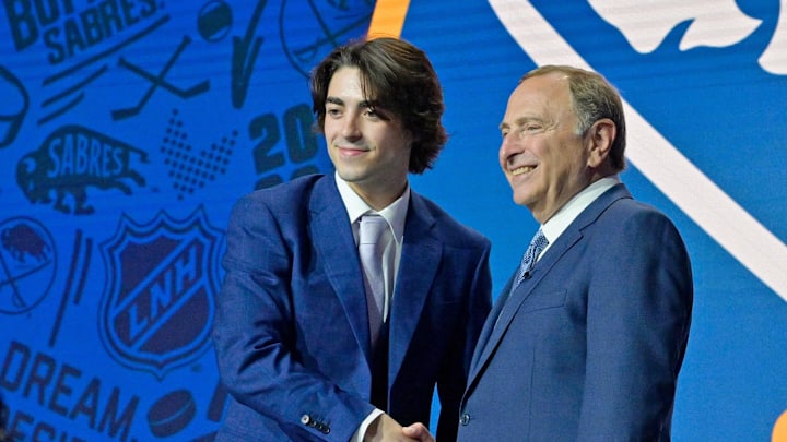 Matthew Savoie shakes hands with NHL commissioner Gary Bettman