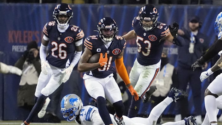 Jan 4, 2026; Chicago, Illinois, USA; Chicago Bears safety Kevin Byard III (31) runs with the ball after making an interception against the Detroit Lions during the second half at Soldier Field. Mandatory Credit: David Banks-Imagn Images