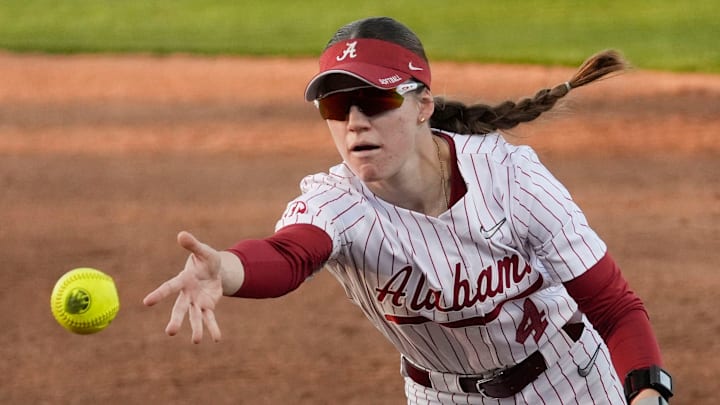 Feb 27, 2026; Tuscaloosa, AL, USA; Alabama second baseman Jena Young underhands the ball to first for an out in the game with St. Thomas in the Crimson Classic at Rhoads Stadium. Feb 27, 2026; Tuscaloosa, AL, USA; Alabama second baseman Jena Young underhands the ball to first for an out in the game with St. Thomas in the Crimson Classic at Rhoads Stadium.