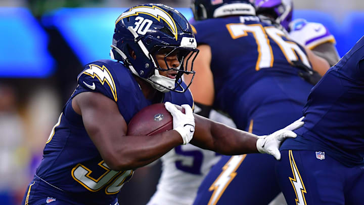 Oct 23, 2025; Inglewood, California, USA; Los Angeles Chargers running back Kimani Vidal (30) rushes the ball against the Minnesota Vikings during the first half at SoFi Stadium. Mandatory Credit: Gary A. Vasquez-Imagn Images