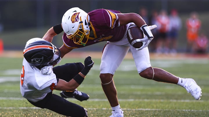 Cooper Jaguars wide receiver Jaidan Combs (3) receives a pass against Ryle Raiders Ryan Handorf (2) during the first half of the high school football game between neighborhood Friday, Sept. 6, 2024, at Cooper High School.