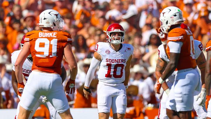 Oklahoma Sooners quarterback John Mateer reacts during the first quarter against the Texas Longhorns at the Cotton Bowl. Oklahoma Sooners quarterback John Mateer reacts during the first quarter against the Texas Longhorns at the Cotton Bowl.