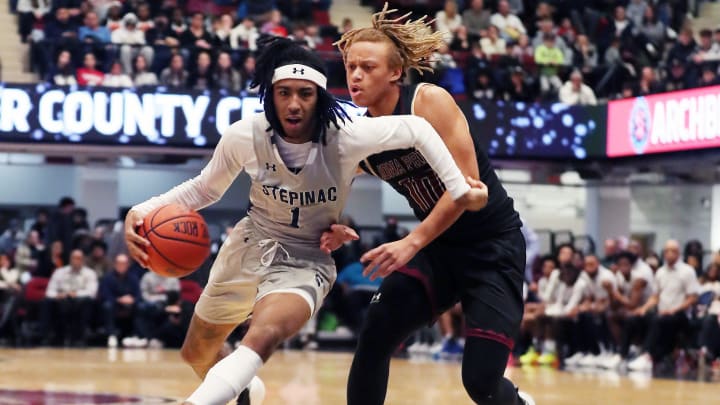 Stepinac's Boogie Fland (1) drives around Iona's Joe Wolf (10) during the Crusader Classic. Stepinac's Boogie Fland (1) drives around Iona's Joe Wolf (10) during the Crusader Classic.