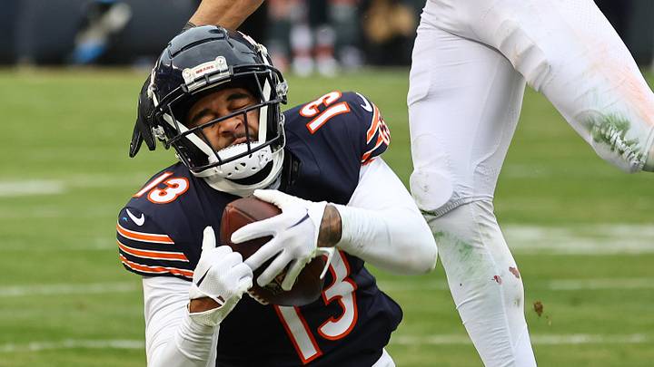 Dec 22, 2024; Chicago, Illinois, USA; Chicago Bears wide receiver Keenan Allen (13) makes a catch Detroit Lions safety Brian Branch (32) during the second half at Soldier Field. Mandatory Credit: Mike Dinovo-Imagn Images