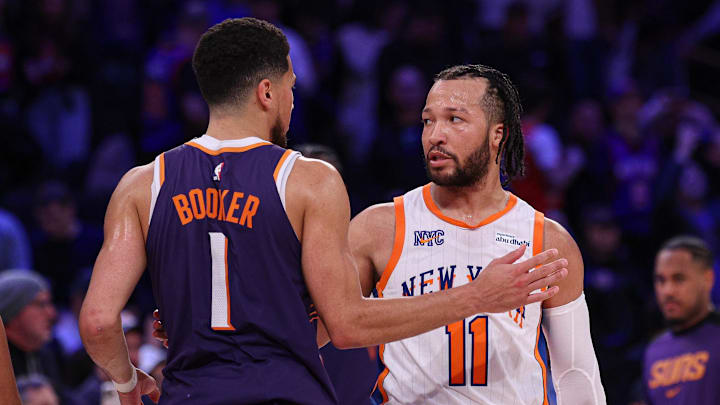 New York Knicks guard Jalen Brunson greets Phoenix Suns guard Devin Booker. Mandatory Credit: Vincent Carchietta-Imagn Images