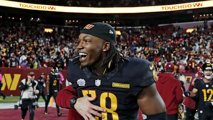 Jordan Magee celebrates after the Washington Commanders beat the Chicago Bears.